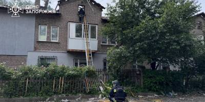 Наслідки удару російського БпЛА по Запоріжжю — пошкоджений будинок і автомобілі